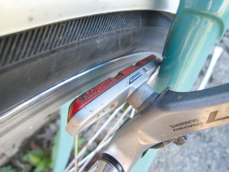 A close-up of the Kool-Stop Salmon Rim Brake Blocks in place on a bike